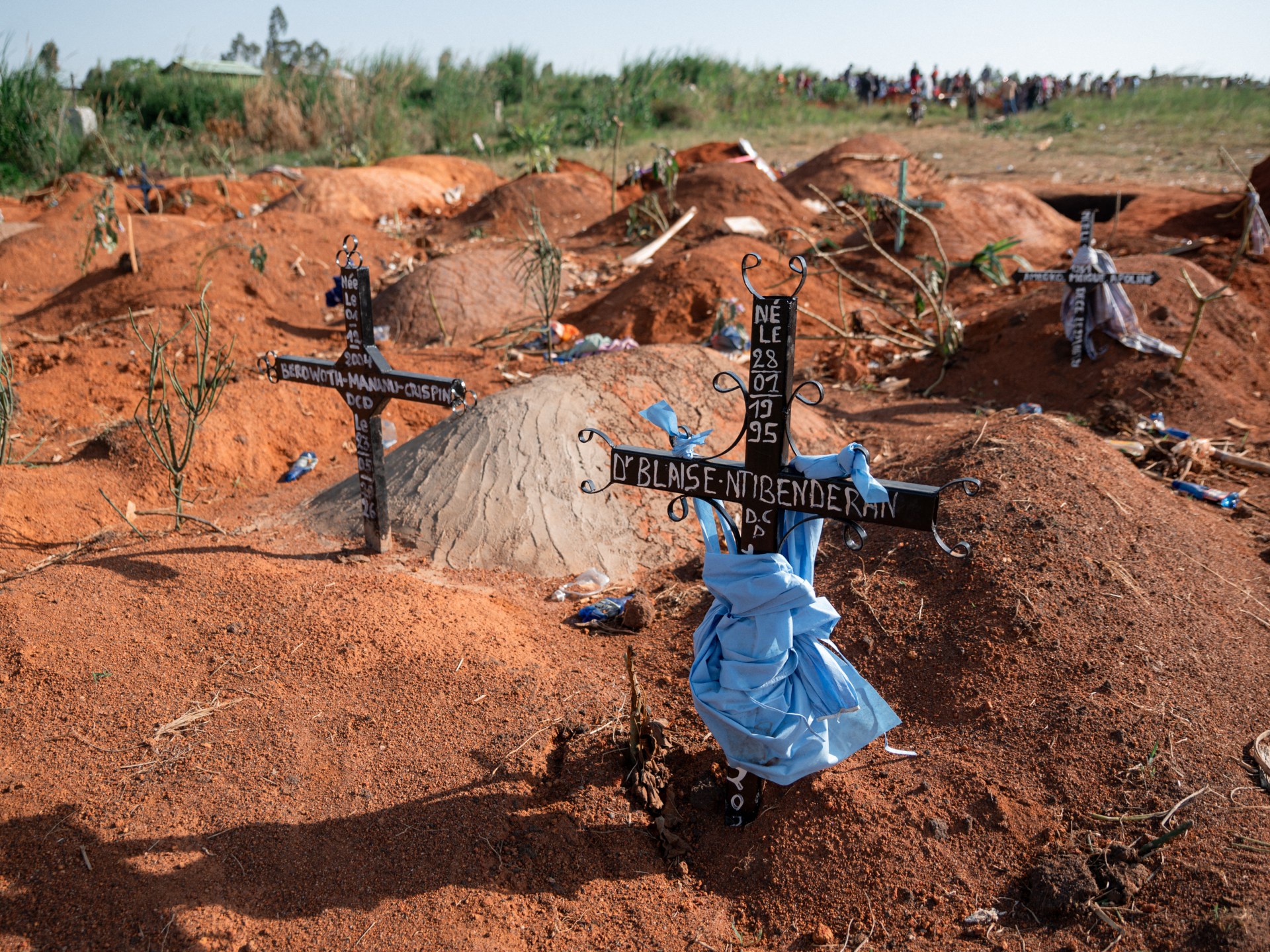 Health workers in PPE outside an Ebola treatment centre in DRC