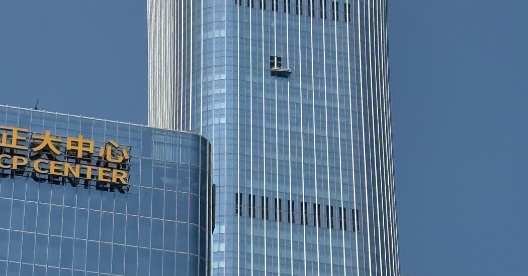 Beijing tower hit by a small plane