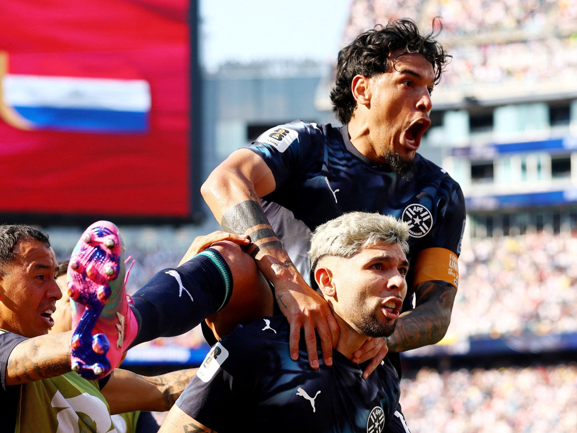 Players react during the Germany-Paraguay World Cup match