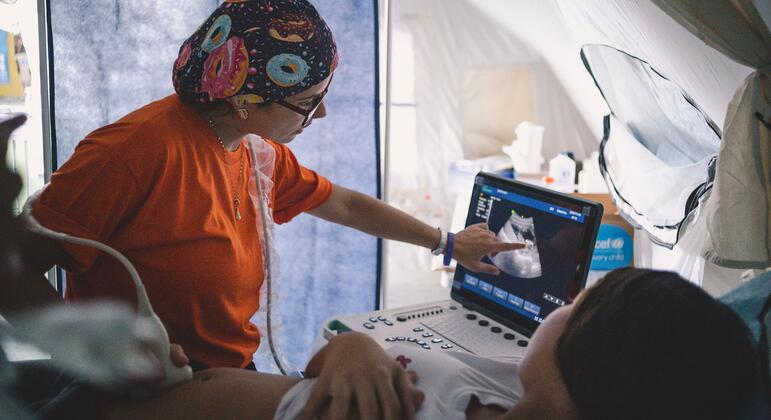 Emergency teams rescue a pregnant woman after earthquakes in Venezuela