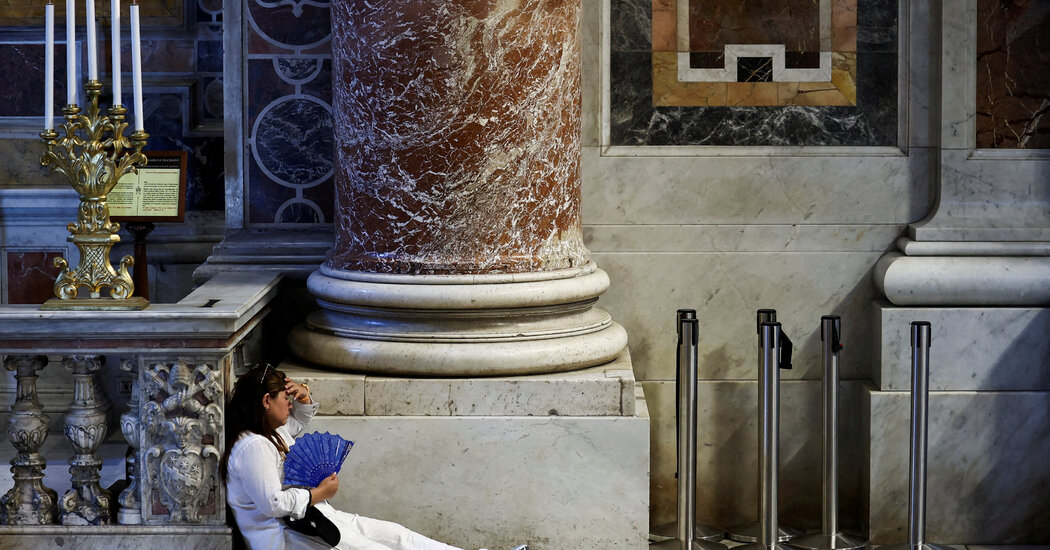 Tourists shelter from the heat in Europe during the fifth heat wave of 2026