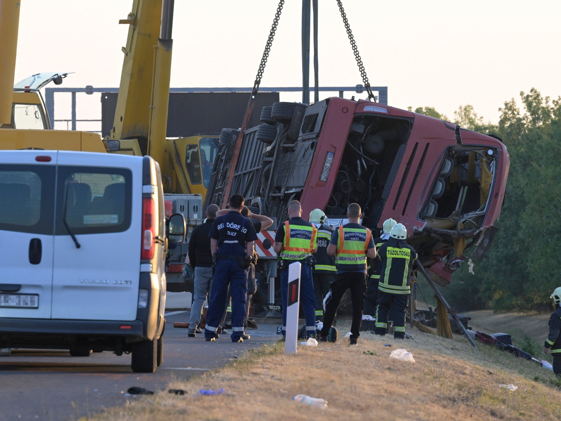 Emergency vehicles at bus crash scene on motorway