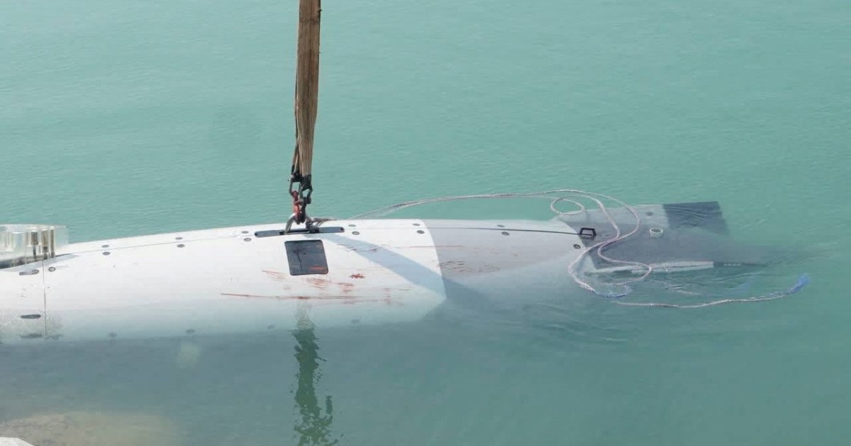 Iranian forces with recovered US submersible vessel