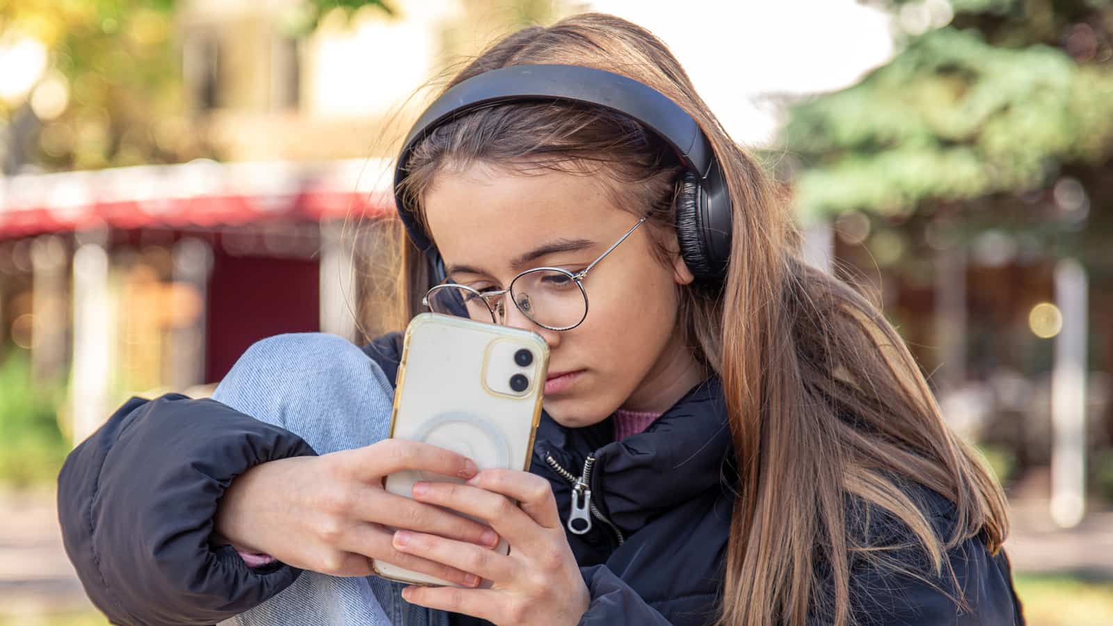 Teenager using a social media app on a smartphone