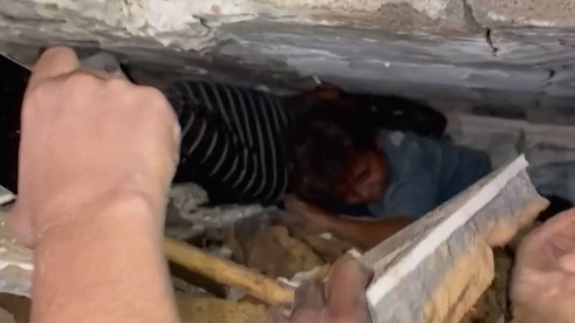 Rescue workers search for survivors after a Gaza building collapse