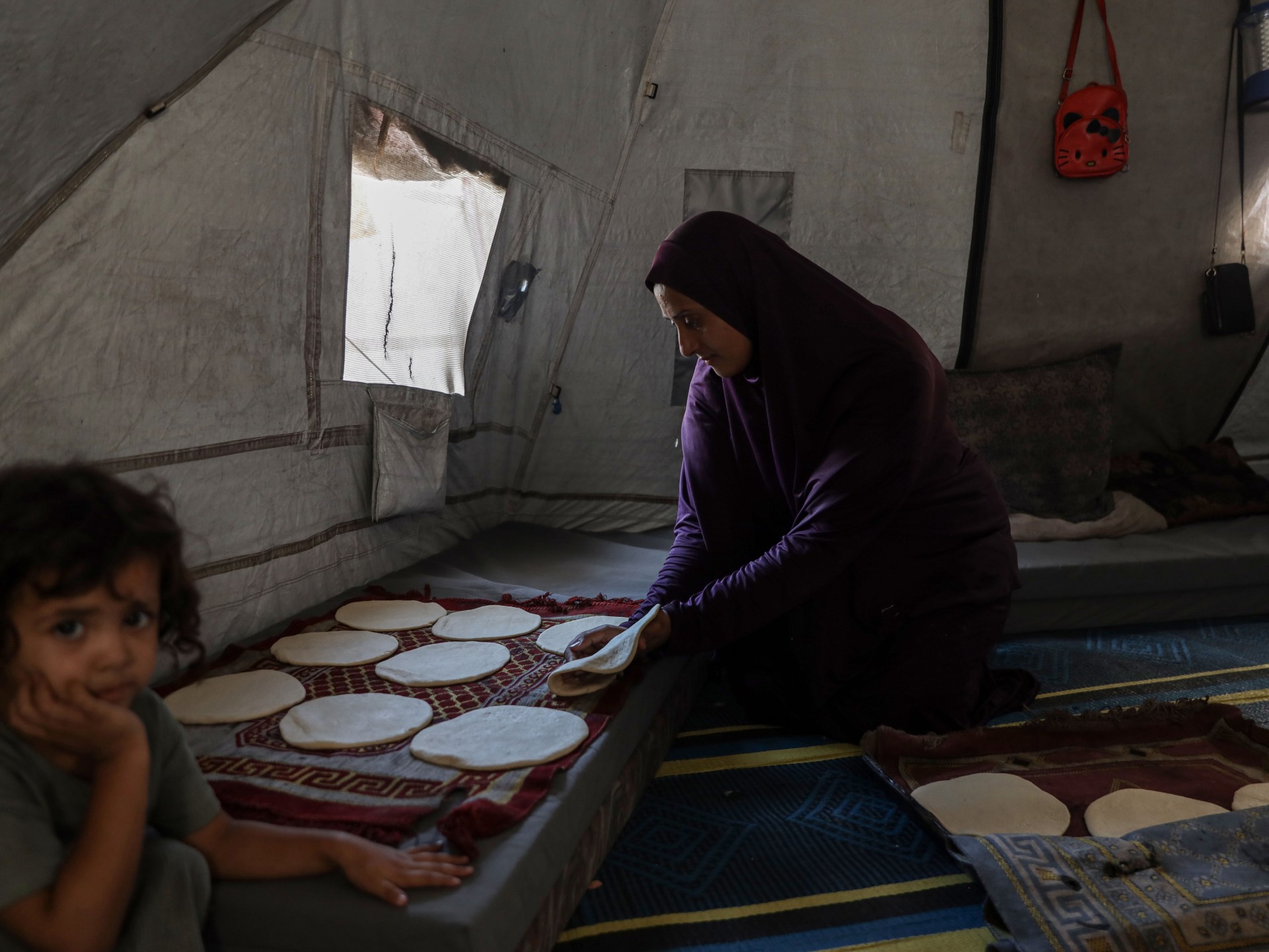 Palestinian families using communal ovens to bake bread in Gaza