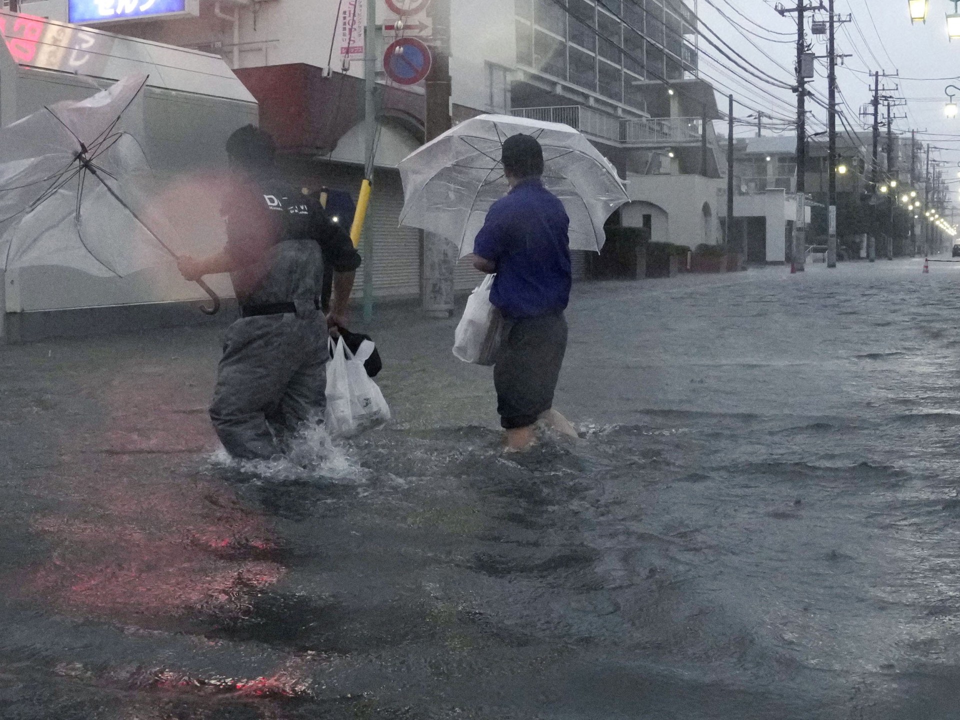 A street in Tokyo submerged by floodwaters from Typhoon Dujuan