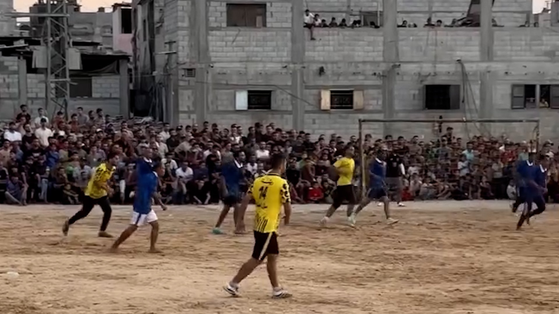 Palestinians playing football in Gaza