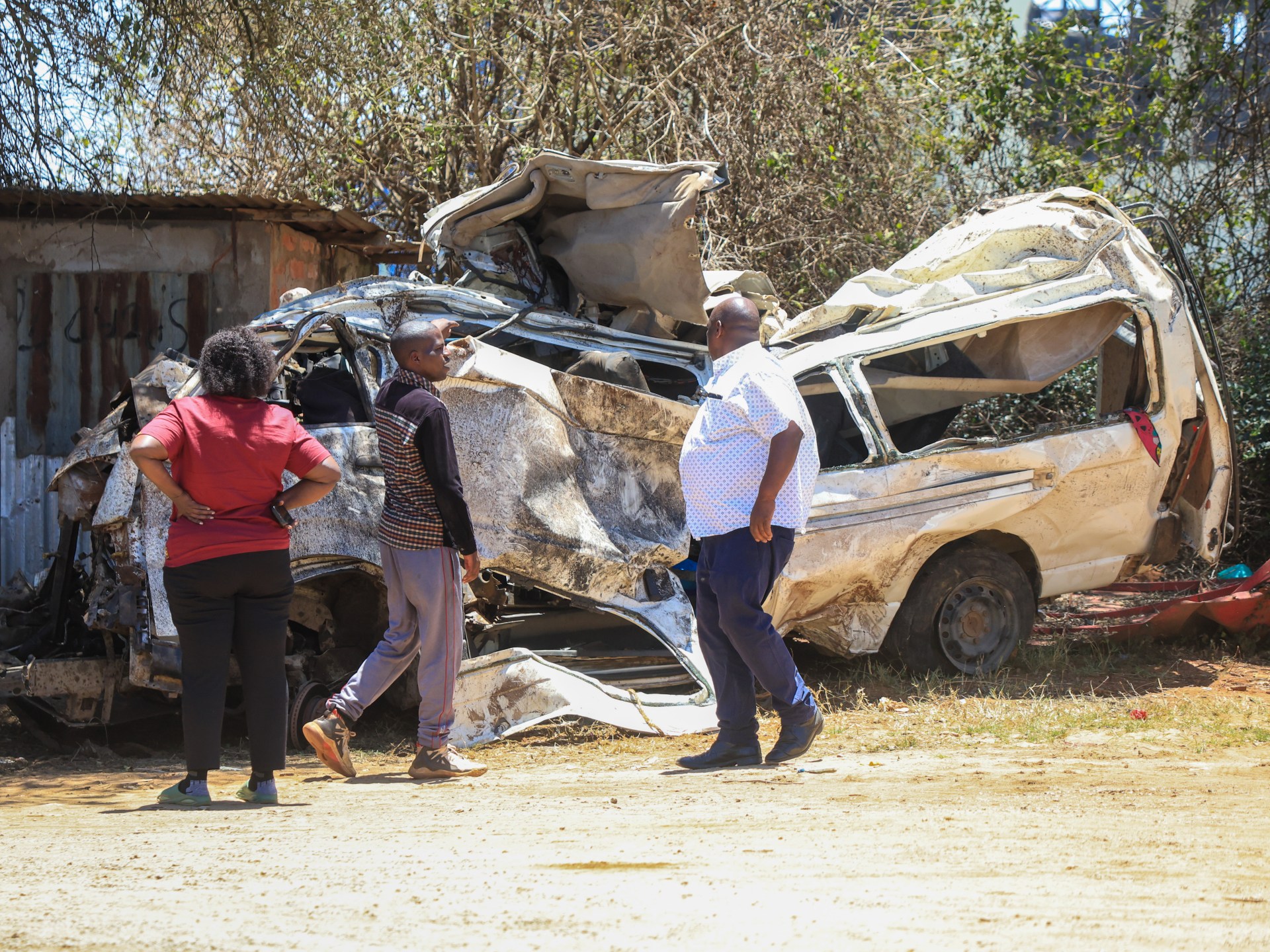 Emergency responders work at the scene of a multi-vehicle collision in Kenya