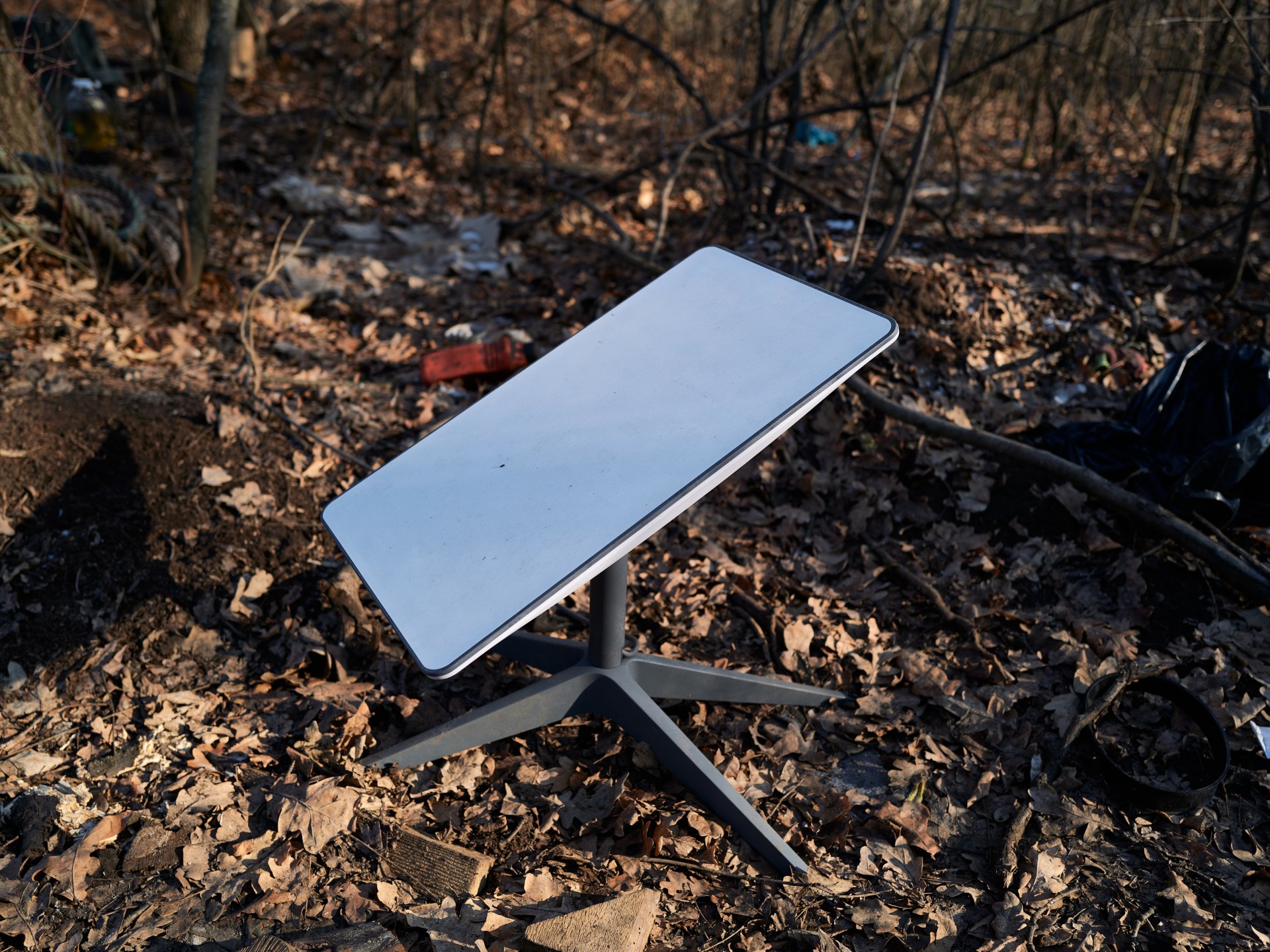 Satellite dish against Iranian landscape